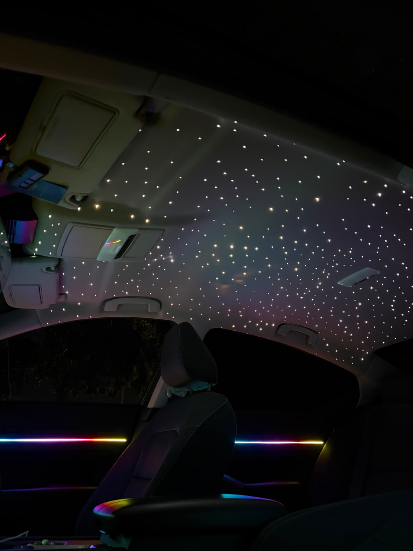 Multicolor starlight headliner with rainbow door strips