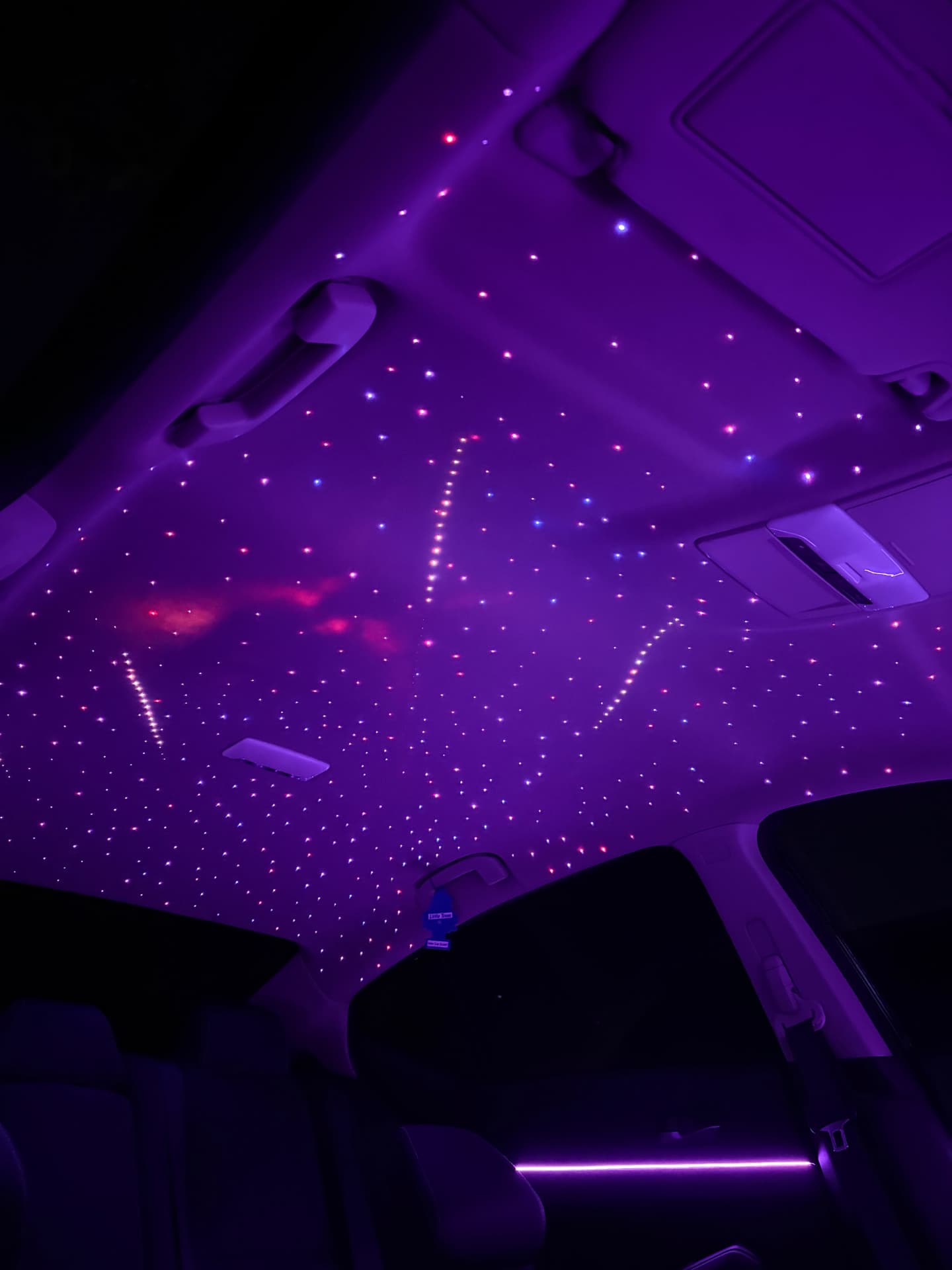 Violet starlight headliner with shooting stars